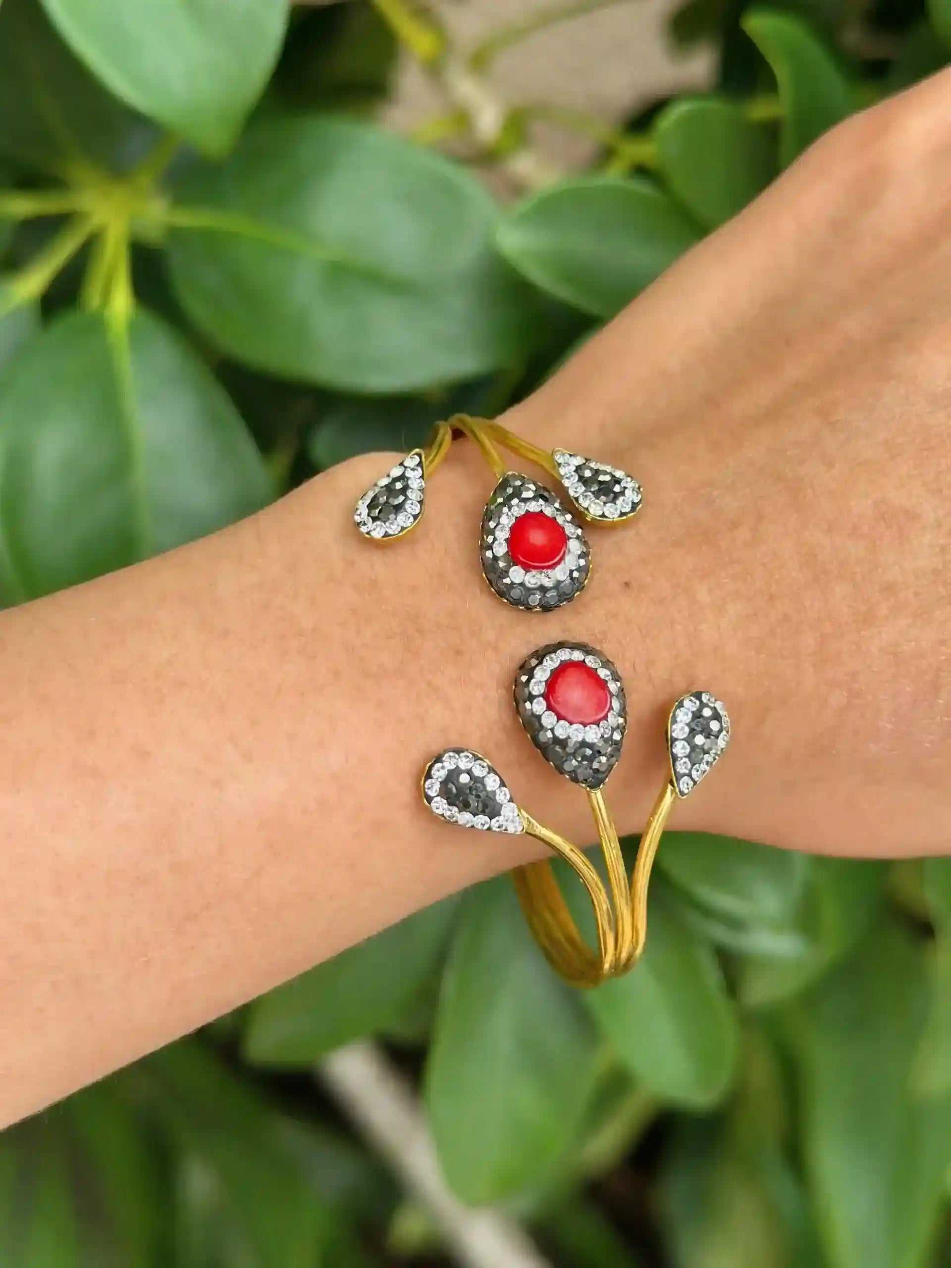 Gold Hematite Stone Cuff bracelet with red hematite stones and 18K gold plating on wrist