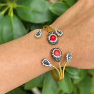 Gold Hematite Stone Cuff bracelet with red hematite stones and 18K gold plating on wrist