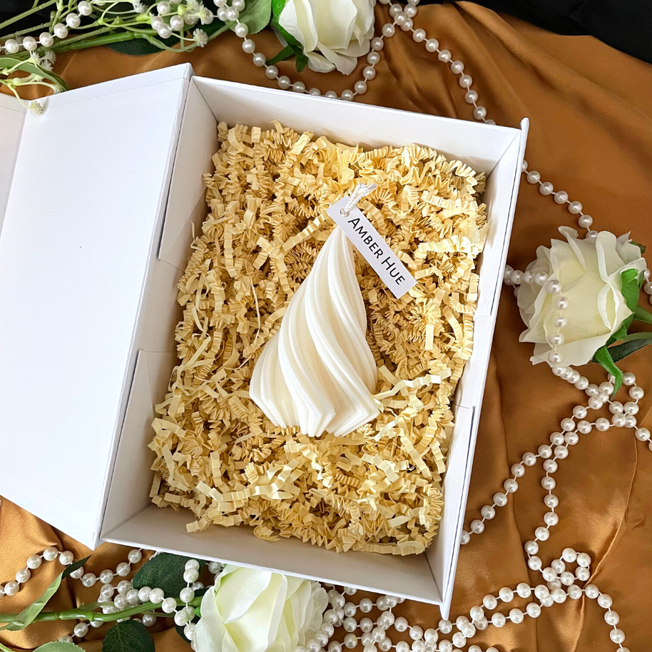 Hand poured soy blend pillar candle from The Twirl collection in white decorative box with shredded paper and floral accents, Essex England handcrafted.
