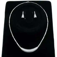 Rhodium CZ Jewelry Set with rhodium-plated necklace and cubic zirconia earrings on black display
