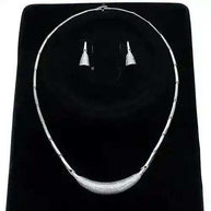 Rhodium CZ Jewelry Set with sparkling cubic zirconia necklace and earrings on black background