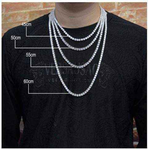 Rock 4 mm CZ tennis chain necklace in multiple lengths displayed on a person wearing a black shirt
