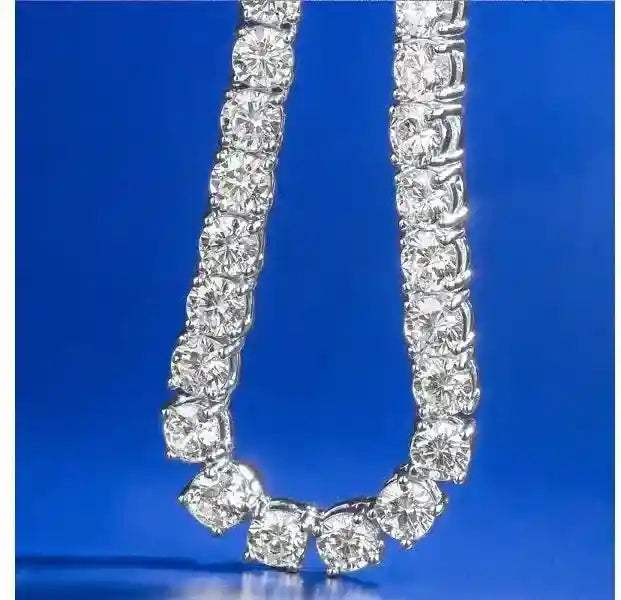 Gold 3 mm CZ tennis chain with sparkling cubic zirconia stones on blue background