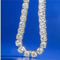 Gold 3 mm CZ tennis chain with sparkling cubic zirconia stones on blue background