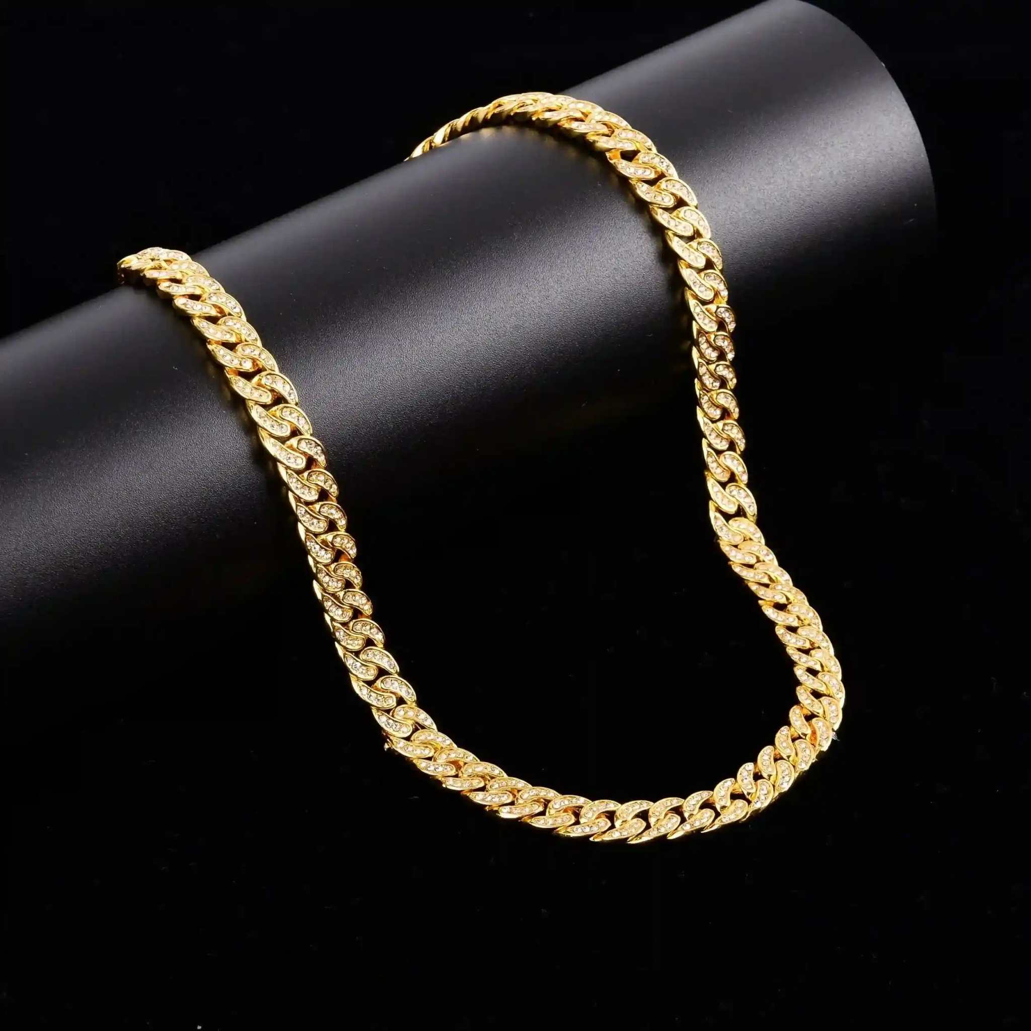 Gold Crystal Cuban Chain 8 mm gold plated brass with crystal accents on black background