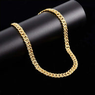 Gold Crystal Cuban Chain 8 mm gold plated brass with crystal accents on black background