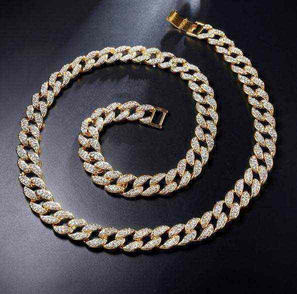 Gold Crystal Cuban Chain with 8 mm iced-out links in 14K yellow gold plating on solid brass.