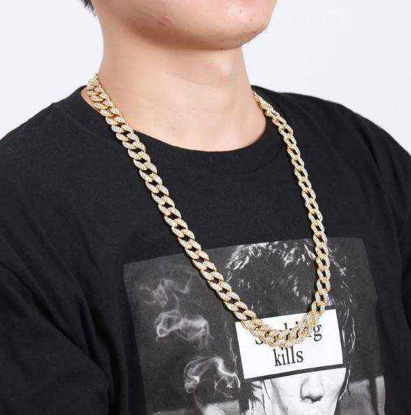 Gold Crystal Cuban Chain 8mm gold plated with crystal accents worn on man in black shirt