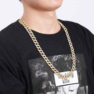 Gold Crystal Cuban Chain 8mm gold plated with crystal accents worn on man in black shirt