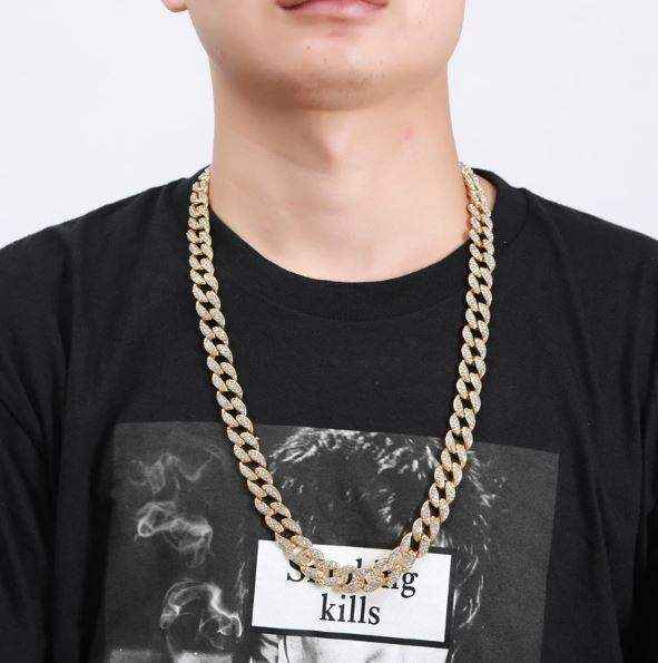 Gold Crystal Cuban Chain 8mm worn on neck with black shirt
