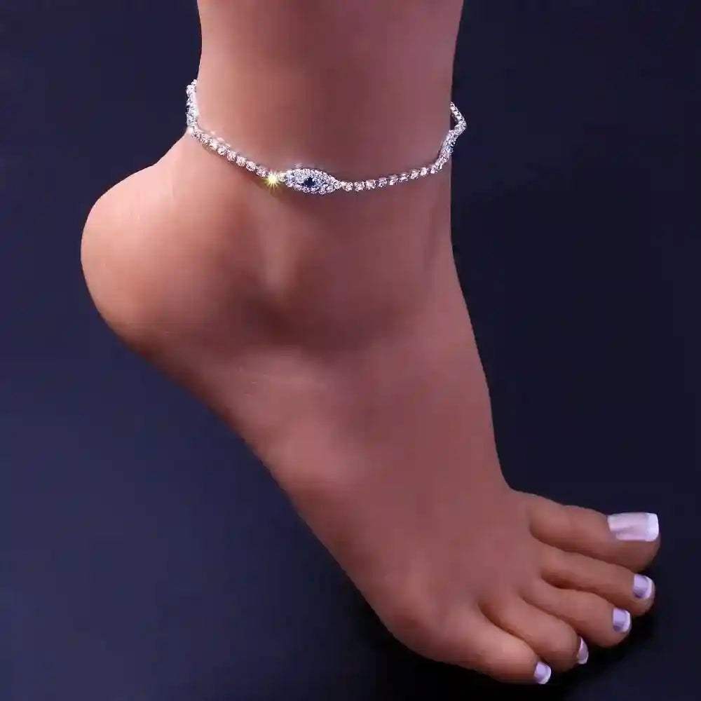 Vintage Evil Eye Crystal Anklet with blue eye charm and cubic zirconia stones on a silver chain worn on ankle