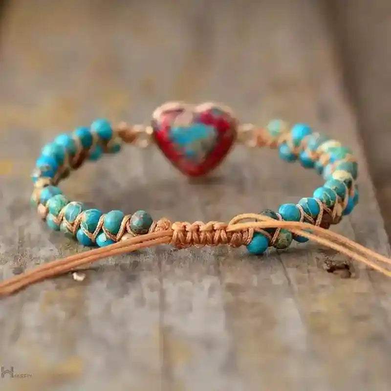 Imperial Jasper Macrame Bracelet with turquoise beads and adjustable lace-up closure on rustic wood background