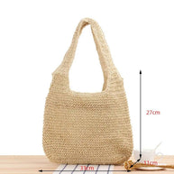 Casual summer shoulder beach bag made of straw with a roomy interior and soft texture for stylish beach days
