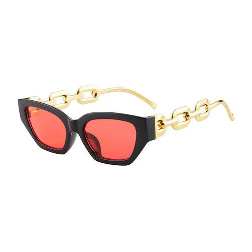Fashion cat eye sunglasses with black frame, red mirror lenses, and gold chain arms.
