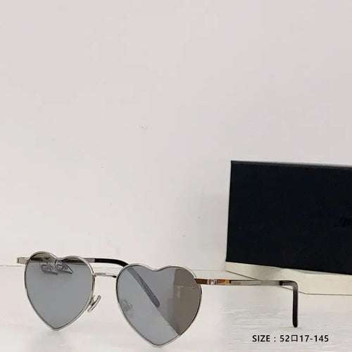Heart a luv sunglasses with heart-shaped lenses, acetate frames, UV400 protection, and photochromic anti-reflective lenses.