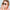 Woman wearing Heart a luv sunglasses with heart-shaped black lenses and thin metal frames