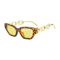 Fashion cat eye sunglasses with tortoiseshell frame, yellow mirrored lenses, and gold chain arms for UV400 protection