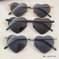 Heart a luv sunglasses in gold, black, and silver heart-shaped frames with dark photochromic lenses