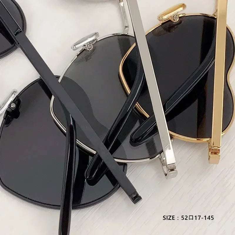Heart a luv sunglasses with acetate frames and photochromic UV400 lenses in black, silver, and gold colors
