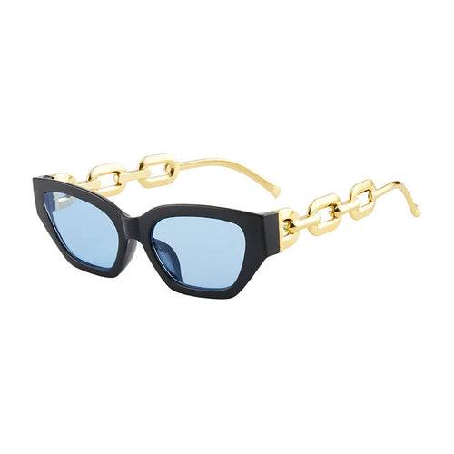 Fashion cat eye sunglasses with black frames, blue mirror lenses, and gold chain-link arms for UV400 protection.