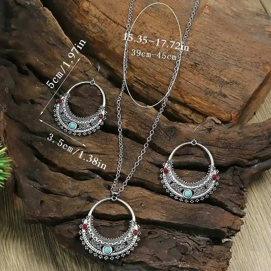 Rustic Tribal Stone Set with turquoise stones and antique silver finish necklace and earrings on wooden background
