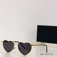Heart a luv sunglasses with gold heart-shaped frames and dark lenses, UV400 protected and photochromic by Sexikinis Swim.