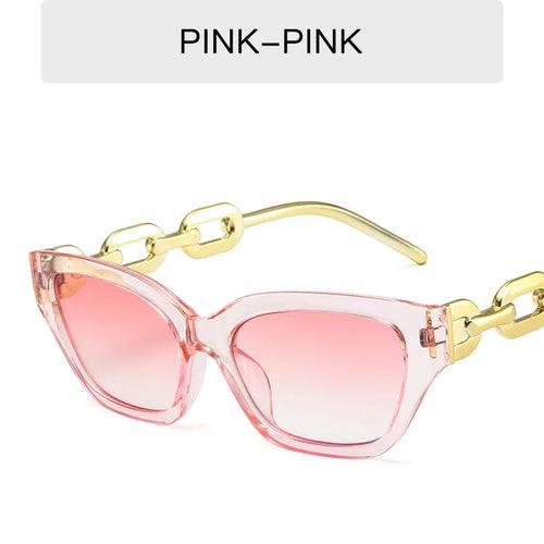 Pink cat eye sunglasses with gold chain temples and pink gradient mirrored lenses
