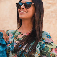 Eyewood ReInvented square acetate and walnut wood sunglasses with polarized lenses worn by woman outdoors