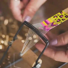Close-up of hands weaving colorful bead-loom strap for St. Tropez Blue Quartz Necklace artisan craftsmanship