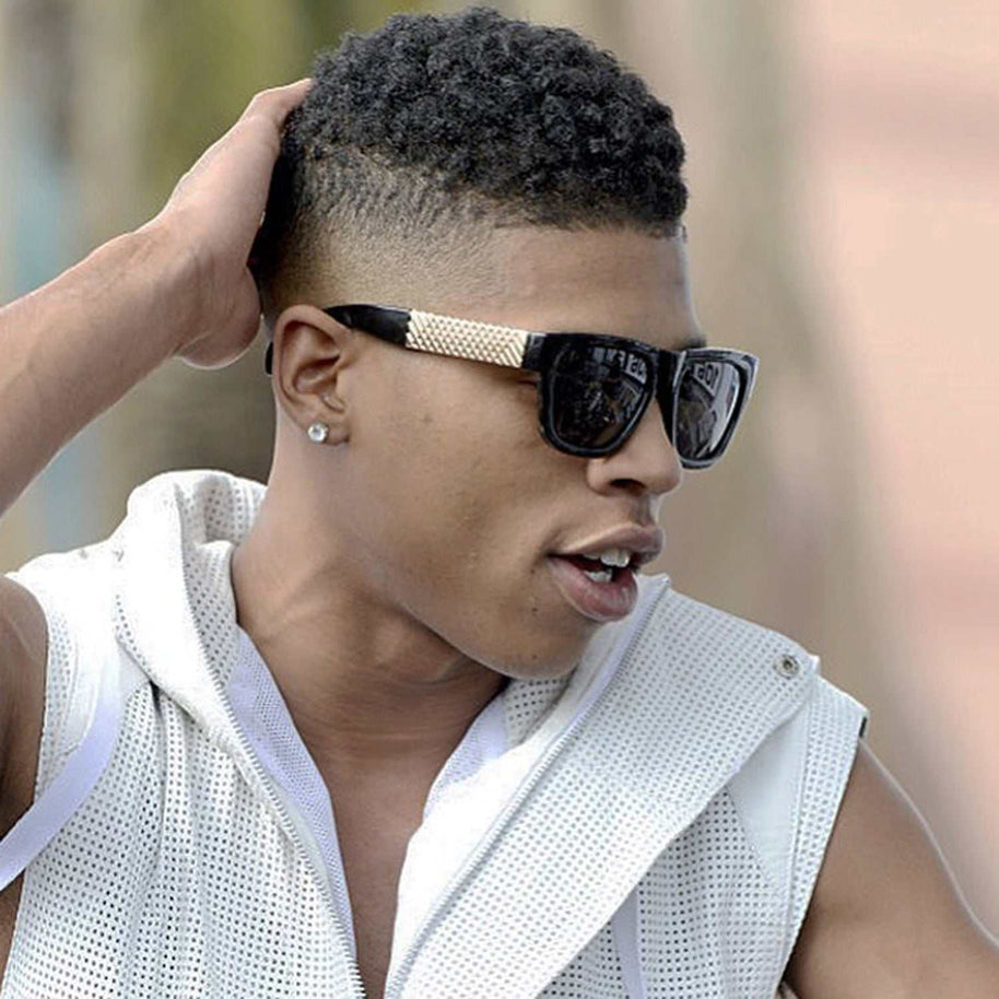Jase New York Royce sunglasses in gloss black with rectangular frame and metal cross hatch temples worn by man