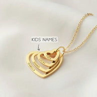 Gold Grandma Heart Name Necklace with four personalized interlocked hearts engraved with kids' names Tara, Lucas, Gianna, Isabella