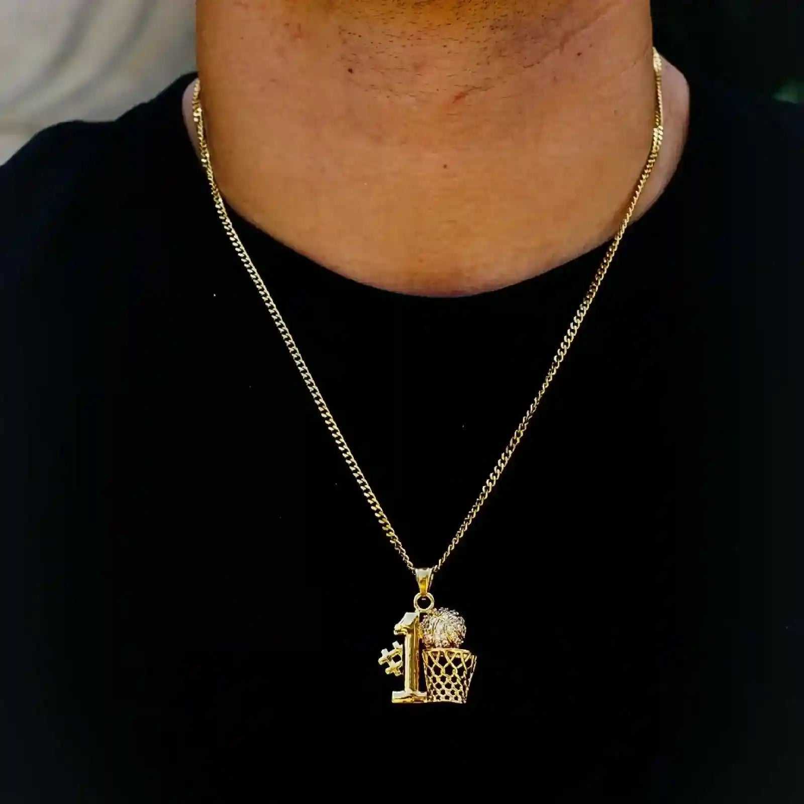 Number 1 Steel Micro Necklace with gold Cuban chain and basketball pendant encrusted with cubic zirconia stones worn on neck