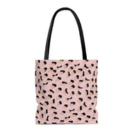 Medium pink leopard print shopper tote bag with black handles and lining, made of 100% polyester