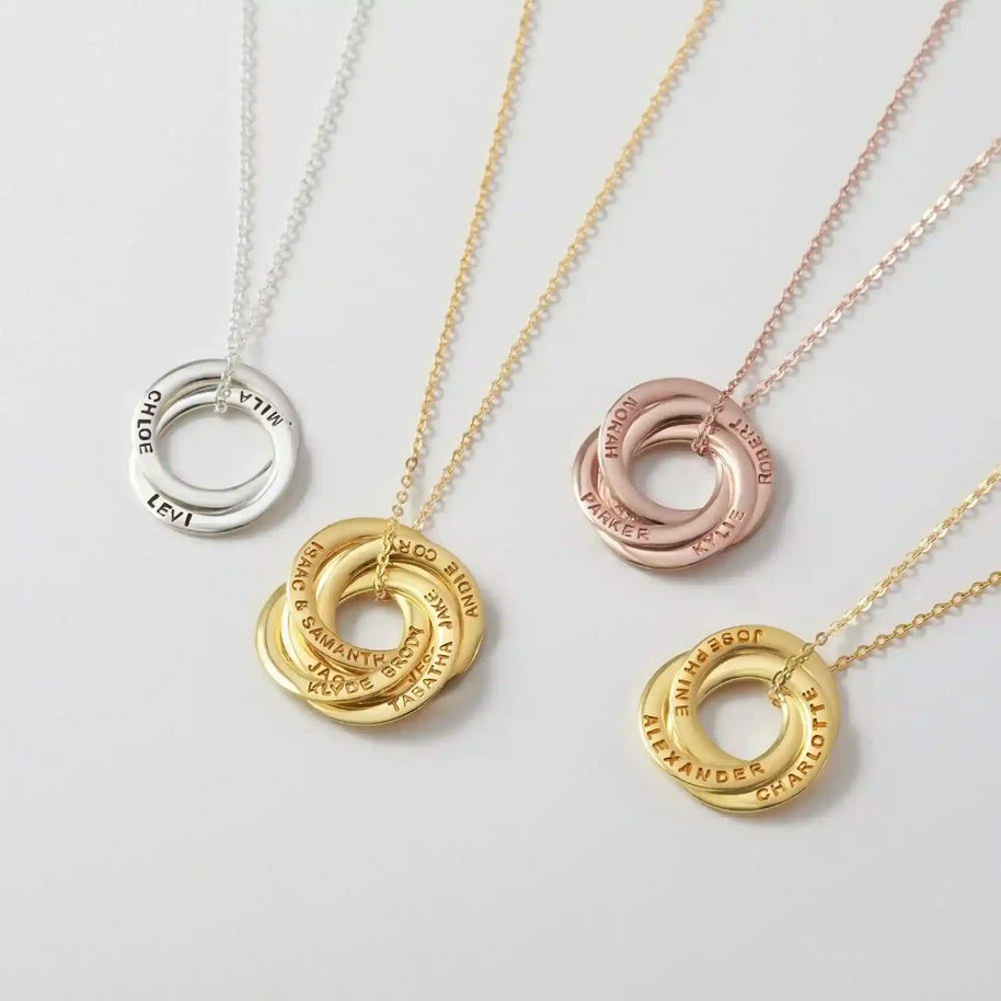 Interlocking Name Ring Necklace with personalized silver, gold, and rose gold rings engraved with names