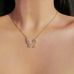 24K gold butterfly necklace with cubic zirconia pendant on adjustable chain worn on neck
