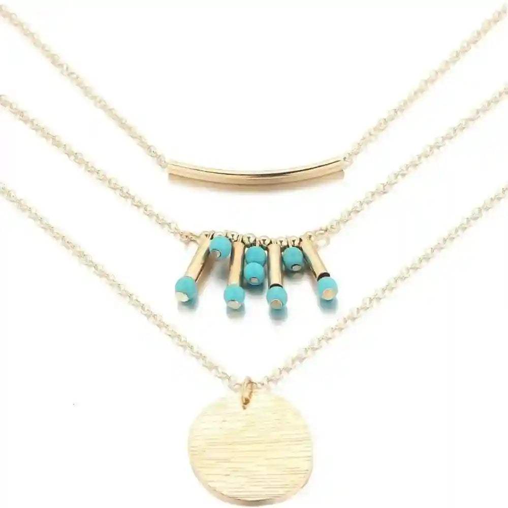Turquoise layered necklace with gold finish, genuine turquoise beads, and adjustable length for versatile styling.