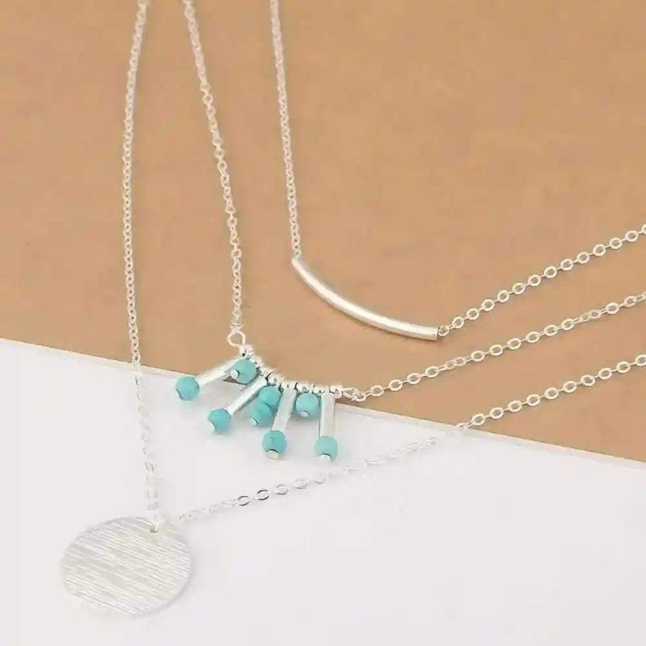 Turquoise layered necklace with silver chains and natural turquoise beads, adjustable length and boho style