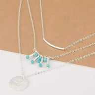 Turquoise layered necklace with silver chains and natural turquoise beads, adjustable length and boho style
