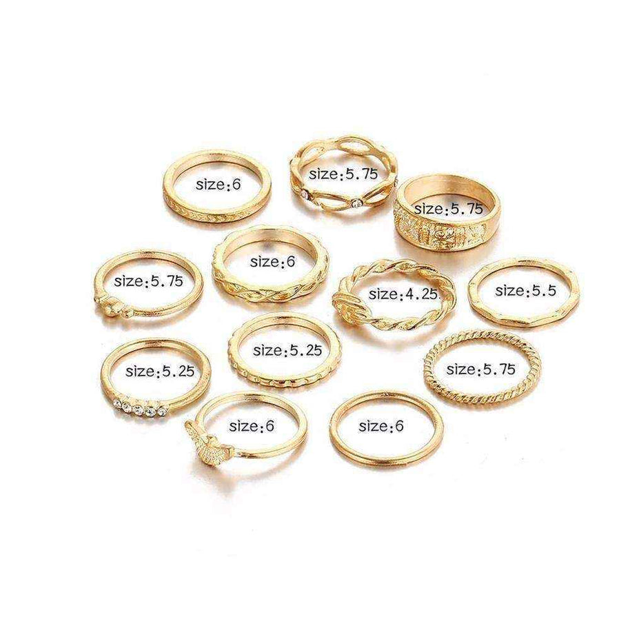 Set of 12 golden gem stackable rings in various sizes with polished finish and stone accents