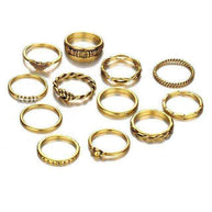 Set of twelve Golden Gem Stackable Rings with unique designs and stone accents, crafted from polished gold-toned zinc alloy for versatile layering and everyday elegance
