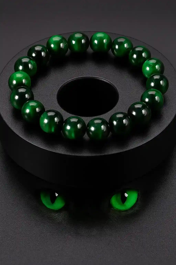 Dark bottle green bead bracelet with polished round beads on a black display against a dark background.