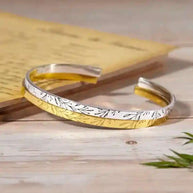 Elegant bridesmaid sparkle bracelet with silver and gold tones and delicate leaf design