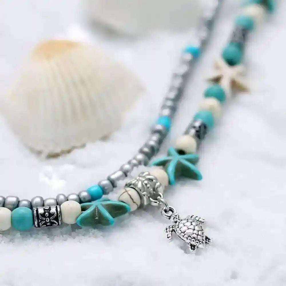 Ocean Double Layer Anklet with turquoise beads and silver turtle charm on white background
