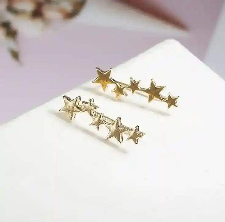 Gold star ear crawlers earrings with a delicate climbing design for a stylish and elegant look