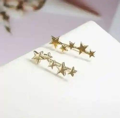 Gold star ear crawlers earrings with multiple star shapes, elegant and lightweight design.