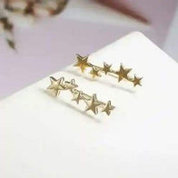 Gold star ear crawlers earrings with multiple star shapes, elegant and lightweight design.
