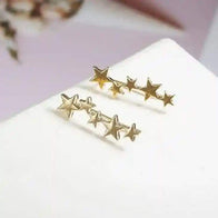 Gold star ear crawlers earrings with a delicate climbing design for a stylish and elegant look